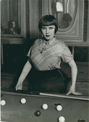 Brassaï, Fille de Montmartre playing Russian billiards,Blvd Rochechouart, 1932-33, Gelatin silver print. 