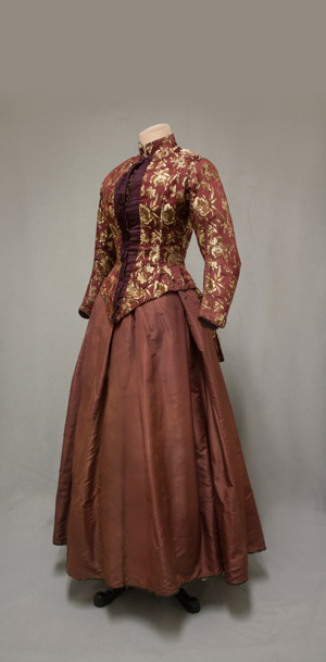 Cranberry brocade bodice and maroon silk taffeta skirt, 1880. 1974 gift from Mrs. Fitch Cheney to the University of Connecticut Historical Clothing and Textile Collection. 