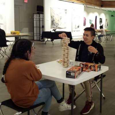 Two Students Playing A Board Game