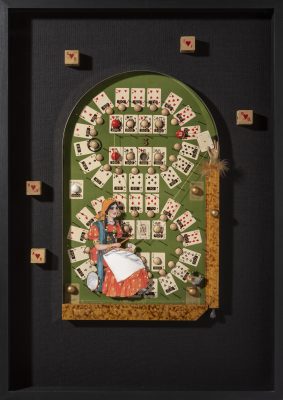 Mixed media collage with woman seated in front of card game.