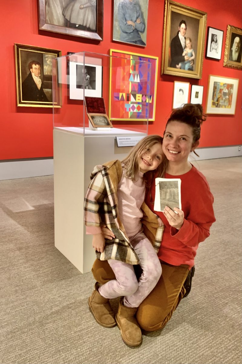 Mother and Daughter posing in the Gilman Gallery with kids activity